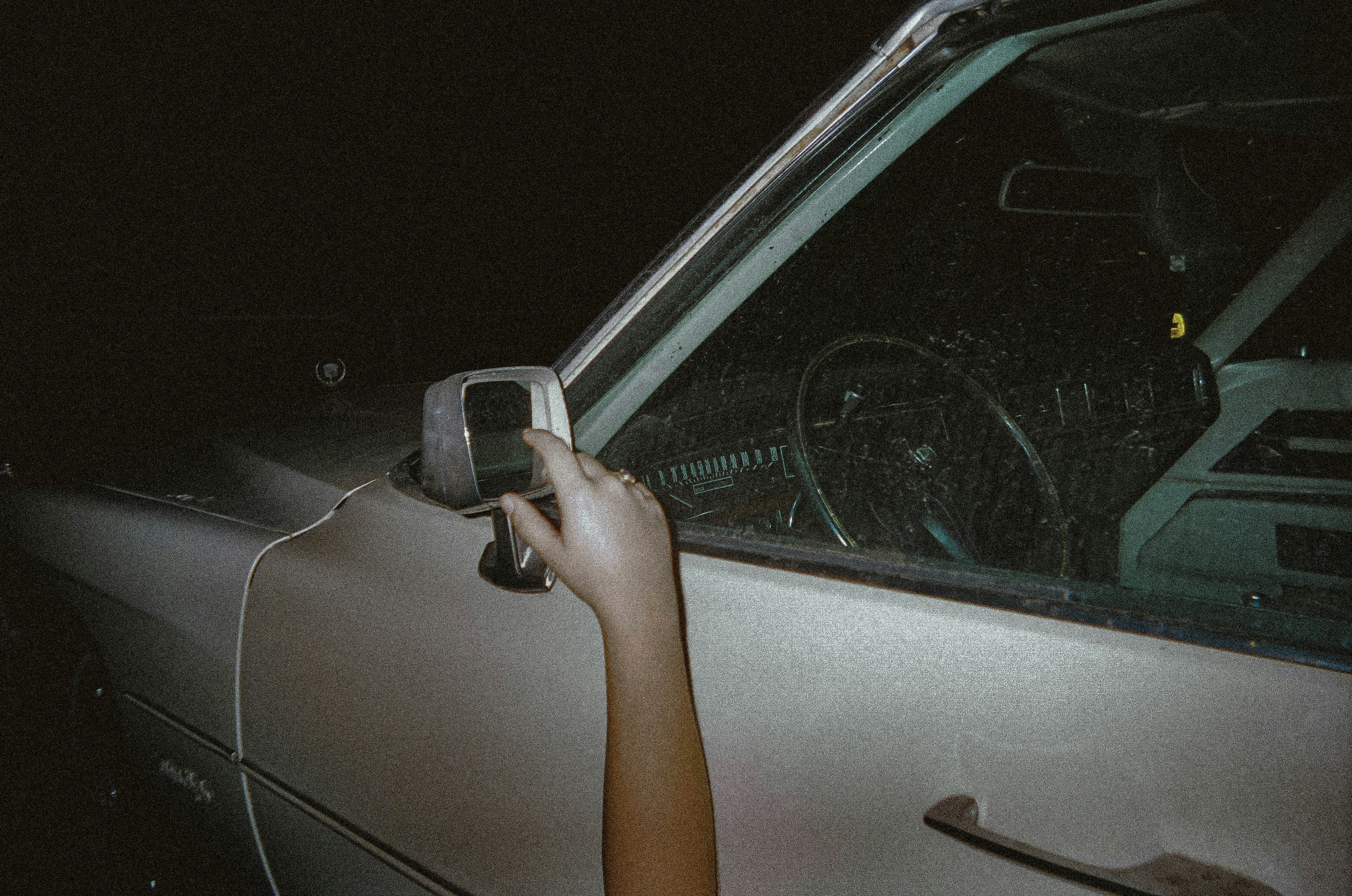 person in car during night time